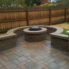Firepit with stonework in backyard