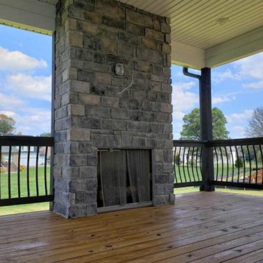 Stone Fireplace Constructed in Decks of Home