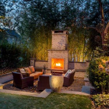 Outdoor Fireplace with outdoor seating and landscape design