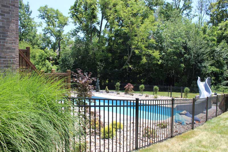 Landscape design around swimming pool with slide