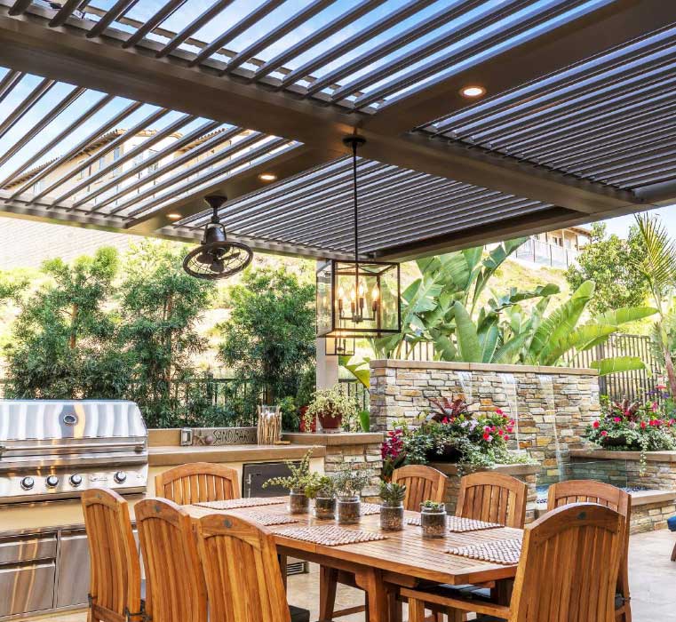 Louvered Roof over outdoor kitchen and dining area