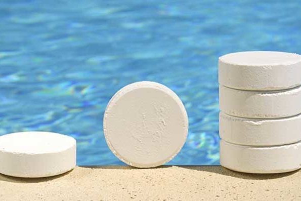 Salt-or-Chlorine Chlorine Tablets for Pool Sanitizing with Pool in the Background