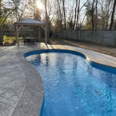 The fantasy pool and covered pavilion in backyard