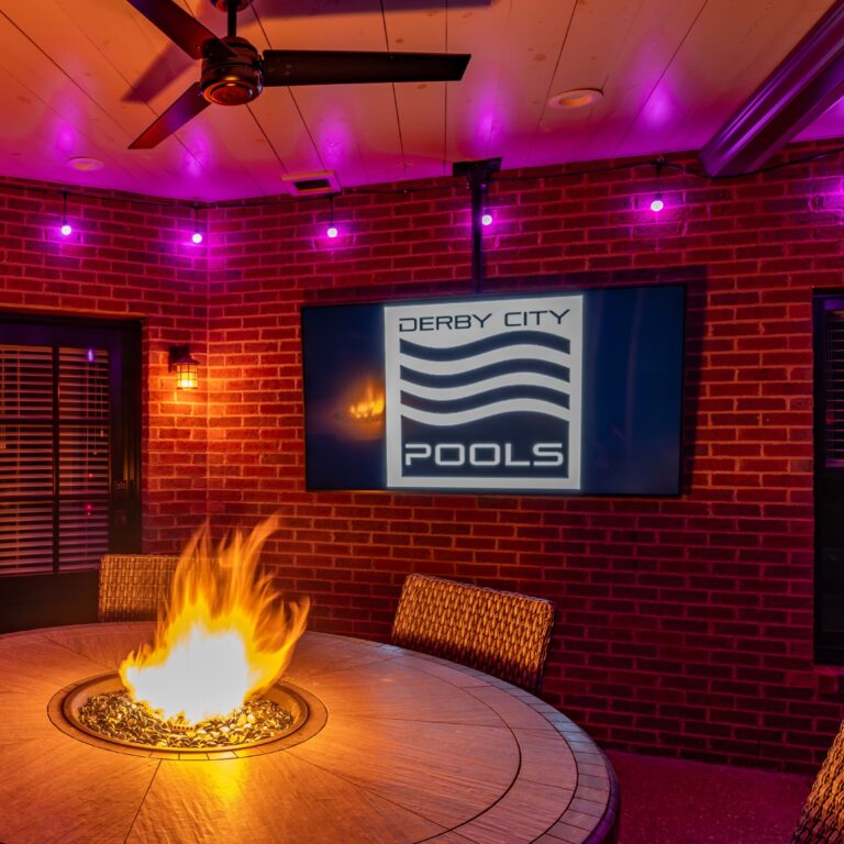 Outdoor TV in front of fire pit, installed by Derby City Pools