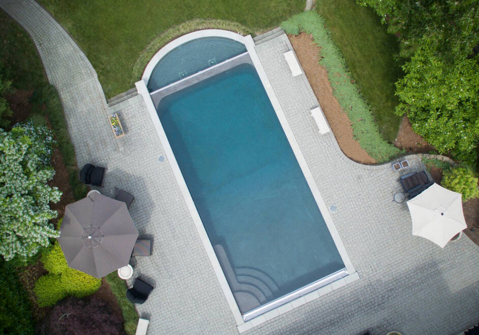 Aerial view of large gunite pool with swim spa