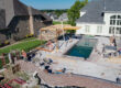 Pool contractors installing a new swimming pool